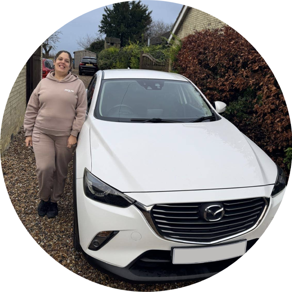 Smiling customer stood next to hercar 